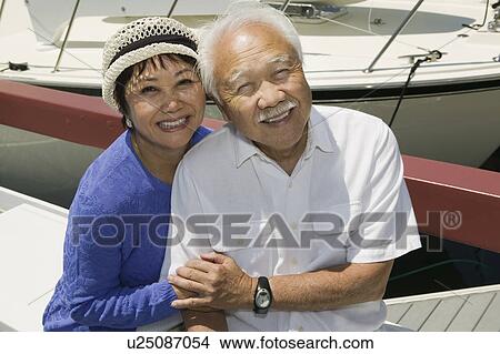 Picture - Senior couple embracing in Marina, (portrait). Fotosearch