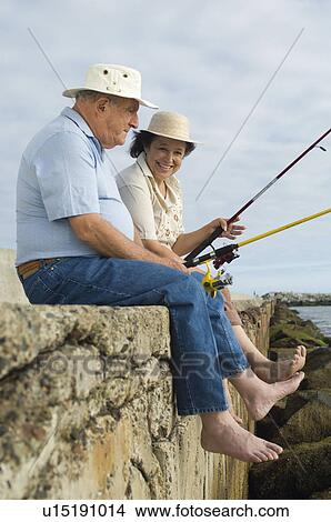 Picture - Senior couple fishing. Fotosearch