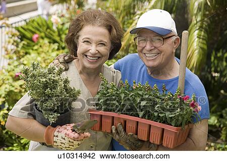 Senior couple gardening, (portrait) View Large Photo Image Stock Image - Senior couple gardening, (portrait). Fotosearch
