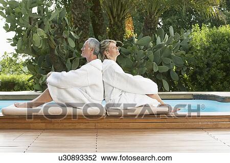 Senior Couple Relaxing by Poolside View Large Photo Image Stock Image - Senior Couple Relaxing by Poolside. Fotosearch