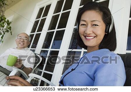 Senior couple relaxing on porch View Large Photo Image Stock Image - Senior couple relaxing on porch. Fotosearch