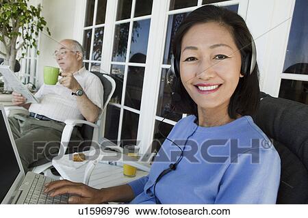 Senior couple relaxing on porch View Large Photo Image Stock Photograph - Senior couple relaxing on porch. Fotosearch