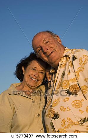 Stock Photo - Senior couple smiling, outdoors, (portrait). Fotosearch