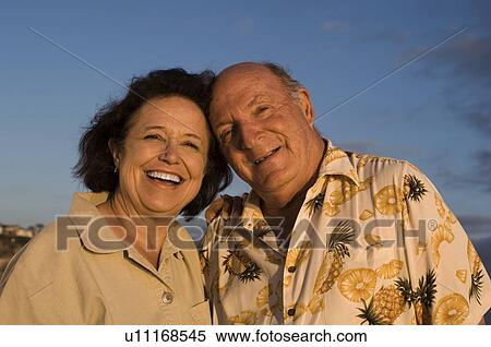 Stock Photography - Senior couple smiling, outdoors, (portrait). Fotosearch