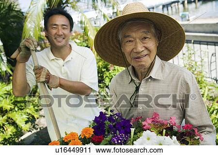 Senior man and son gardening, (portrait) View Large Photo Image Stock Image - Senior man and son gardening, (portrait). Fotosearch