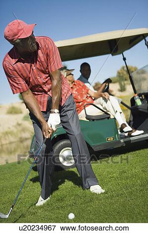 Senior man putting green View Large Photo Image Stock Photo - Senior man putting green. Fotosearch