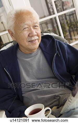 Senior man with coffee relaxing, outdoors View Large Photo Image Stock Image - Senior man with coffee relaxing, outdoors. Fotosearch