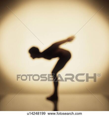 Stock Photo - Silhouette of man bending down. Fotosearch