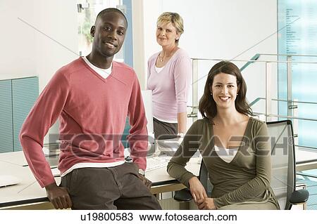 Stock Image - Small group of office workers, portrait. Fotosearch