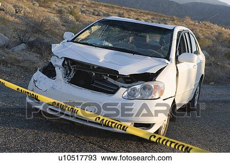 Smashed car cordoned off behind police tape View Large Photo Image Stock Image - Smashed car cordoned off behind police tape. Fotosearch