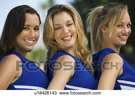 Stock Image - Smiling Cheerleaders, (portrait). Fotosearch