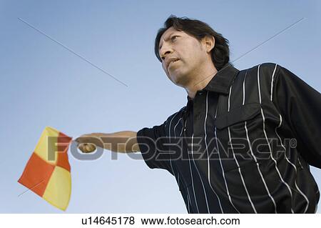 Soccer linesman waving flag, portrait View Large Photo Image Stock Photo - Soccer linesman waving flag, portrait. Fotosearch