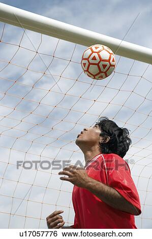 Soccer player heading ball, portrait View Large Photo Image Stock Photograph - Soccer player heading ball, portrait. Fotosearch
