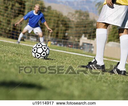 Soccer player preparing to shoot, low section View Large Photo Image Stock Photo - Soccer player preparing to shoot, low section. Fotosearch