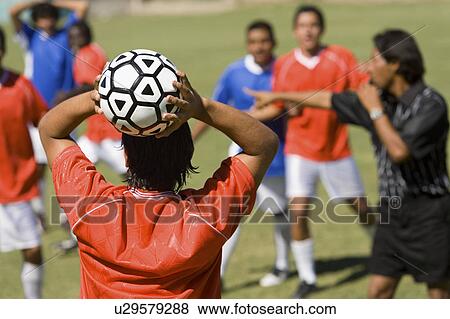 Soccer player throwing in ball, back view View Large Photo Image Stock Photo - Soccer player throwing in ball, back view. Fotosearch