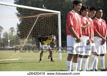 Stock Photo - Soccer players preparing for free kick. Fotosearch