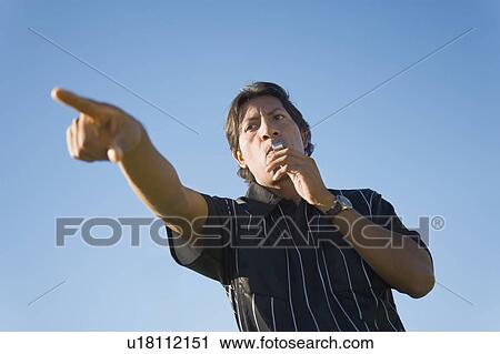 Soccer referee blowing whistle and pointing, portrait View Large Photo Image Stock Image - Soccer referee blowing whistle and pointing, portrait. Fotosearch