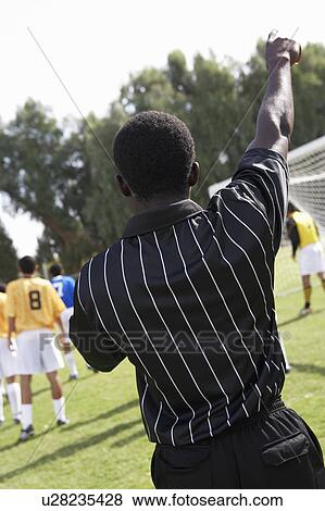 Soccer referee pointing, back view View Large Photo Image Stock Photo - Soccer referee pointing, back view. Fotosearch