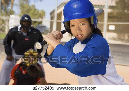 Softball player at bat, close-up View Large Photo Image Stock Photography - Softball player at bat, close-up. Fotosearch