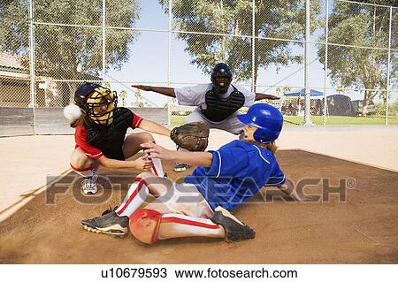 Softball player slideing into home plate View Large Photo Image Stock Image - Softball player slideing into home plate. Fotosearch