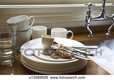 Stack of Dirty Dishes and silverware by Sink View Large Photo Image Stock Photo - Stack of Dirty Dishes and silverware by Sink. Fotosearch