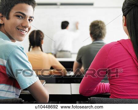 Students sitting in classroom View Large Photo Image Stock Image - Students sitting in classroom. Fotosearch