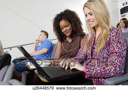 Students using laptop in classroom View Large Photo Image Stock Photo - Students using laptop in classroom. Fotosearch