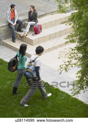 Students walking and sitting on school grounds outdoors, elevated view View Large Photo Image Stock Photography - Students walking and sitting on school grounds outdoors, elevated view. Fotosearch