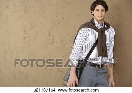 Picture - Stylish Man by wall, portrait. Fotosearch