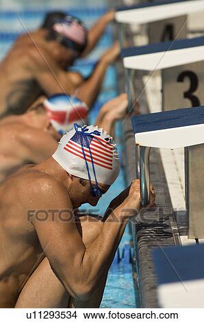 Swimmers Lined Up at Starting Blocks View Large Photo Image Picture - Swimmers Lined Up at Starting Blocks. Fotosearch