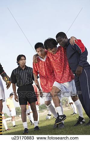Team-mates carrying injured soccer player View Large Photo Image Stock Image - Team-mates carrying injured soccer player. Fotosearch