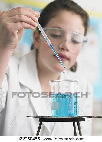 Teenage girl caring out experiments in chemistry class, close-up View Large Photo Image Stock Photography - Teenage girl caring out experiments in chemistry class, close-up. Fotosearch