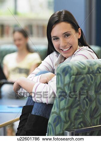 Teenage girl sitting on armchair View Large Photo Image Stock Photograph - Teenage girl sitting on armchair. Fotosearch