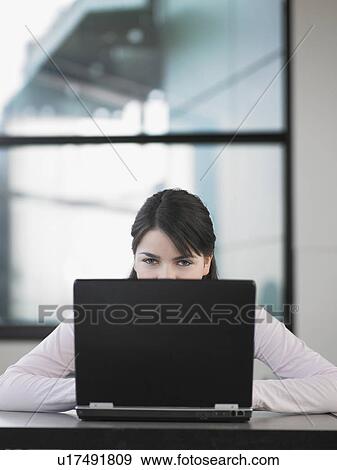 Teenage girl using laptop in classroom View Large Photo Image Stock Photo - Teenage girl using laptop in classroom. Fotosearch