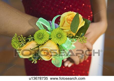 Teenage girl wearing corsage, close-up of flowers View Large Photo Image Stock Photography - Teenage girl wearing corsage, close-up of flowers. Fotosearch
