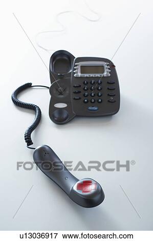 Stock Photo - Telephone, red tape forming letter x on receiver. Fotosearch