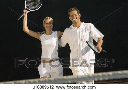 Tennis Partners skipping side by side, arms around, celebrating Victory View Large Photo Image Stock Image - Tennis Partners skipping side by side, arms around, celebrating Victory. Fotosearch