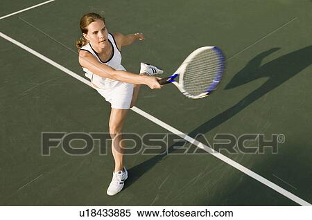 Stock Photography - Tennis Player swinging racket in Forehand motion. Fotosearch