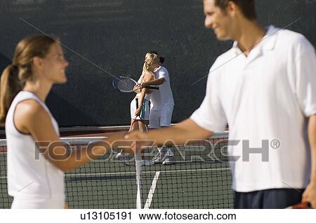 Tennis Players Shaking Hands at Net, side view View Large Photo Image Stock Image - Tennis Players Shaking Hands at Net, side view. Fotosearch
