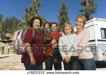 Three-generation family standing outside of RV in campground View Large Photo Image Stock Image - Three-generation family standing outside of RV in campground. Fotosearch