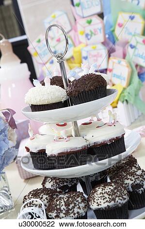 Stock Image - Tray of Cupcakes at a Baby Shower. Fotosearch