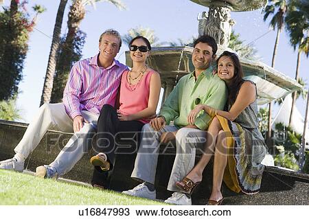 Two couples by fountain, portrait View Large Photo Image Stock Image - Two couples by fountain, portrait. Fotosearch