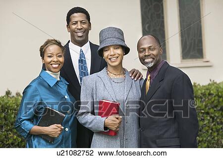 Two happy Couples in garden holding Bibles, portrait View Large Photo Image Stock Image - Two happy Couples in garden holding Bibles, portrait. Fotosearch