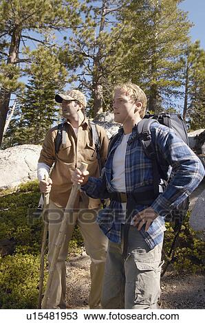 Stock Image - Two hikers in woodland. Fotosearch
