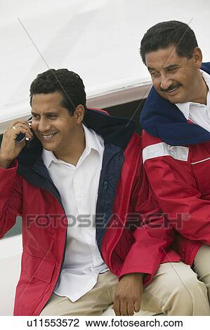 Two men relaxing on yacht View Large Photo Image Stock Image - Two men relaxing on yacht. Fotosearch