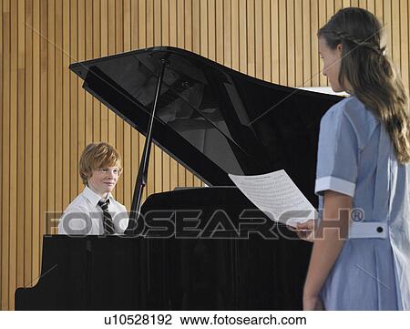Two students performing in music class View Large Photo Image Stock Image - Two students performing in music class. Fotosearch