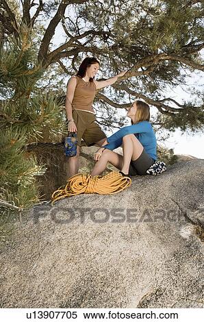 Two woman climbers on boulder View Large Photo Image Stock Photography - Two woman climbers on boulder. Fotosearch
