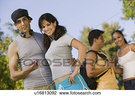 Two young couples outdoors. View Large Photo Image Stock Image - Two young couples outdoors.. Fotosearch