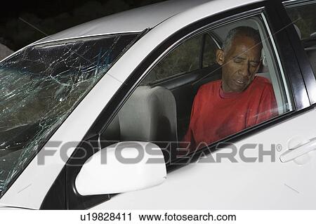 Stock Image - Unconscious victim of car accident. Fotosearch