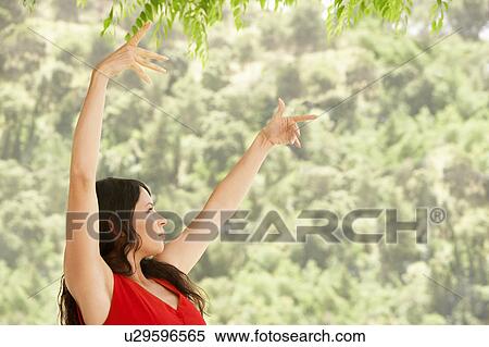 Woman dancing outdoors, side view. View Large Photo Image Stock Photography - Woman dancing outdoors, side view.. Fotosearch